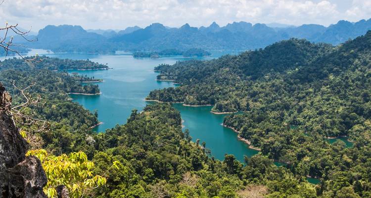Panoramic vista of emerald lakes and densely forested hills in Khao Sok National Park
