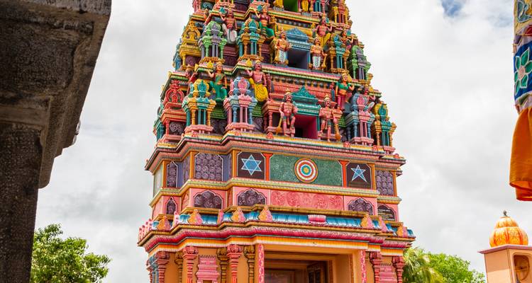 Colorful Hindu temple tower with intricate details.