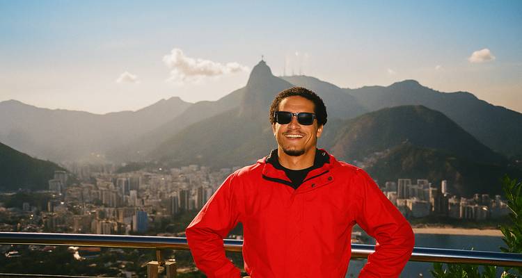 Person in a red jacket with a city and mountain backdrop, similar to another photo.