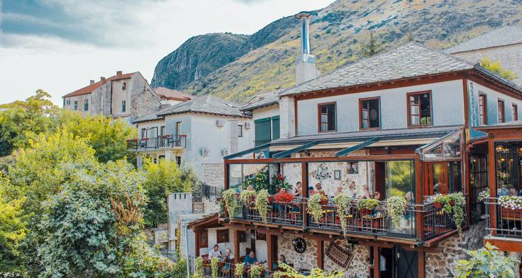 Charming hillside village with lush greenery.