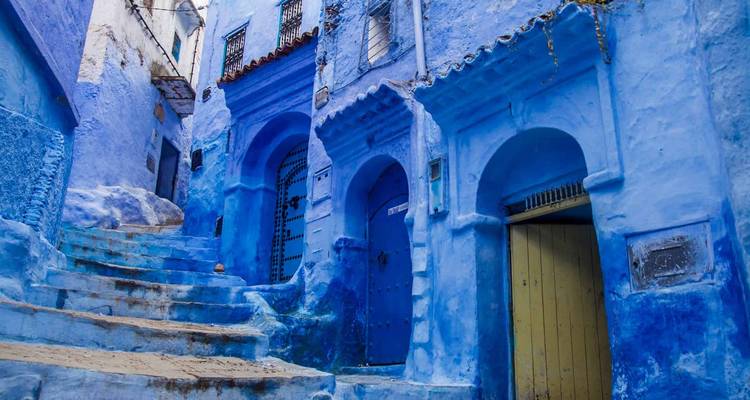 Blue-painted street with steps.