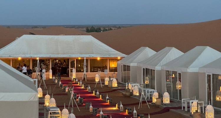 Evening scene of a luxury desert camp.