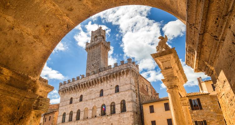 Historic building under a blue sky in Montepulciano.