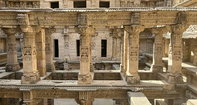A historical structure with intricate stone carvings and columns.