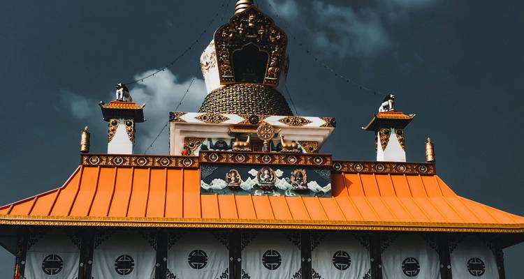A traditionally styled temple building with ornate decorations.