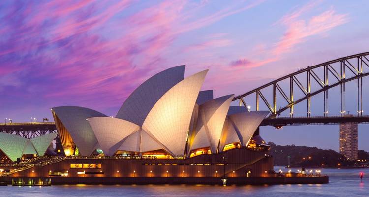 Sydney Opera House and Harbour Bridge at dusk.