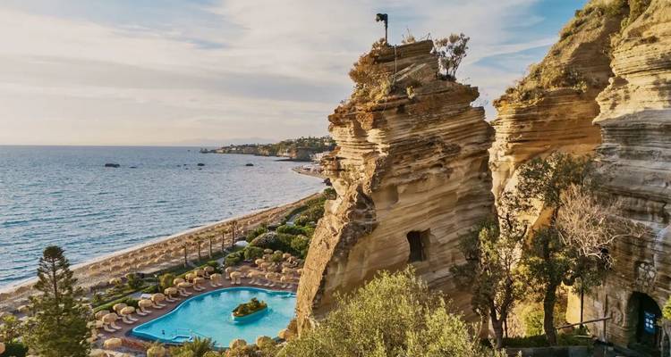 Cliffside pool with a stunning view of the beach and ocean.