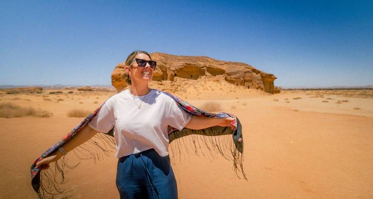 A person enjoying a sunny day in a desert area.