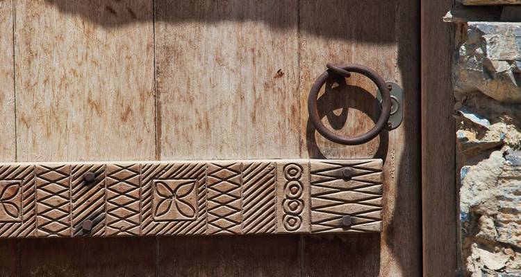 A close-up of a decorated wooden door.