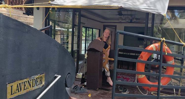 Person posing on a houseboat named Lavender.