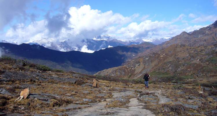 A lone hiker on a mountain path.