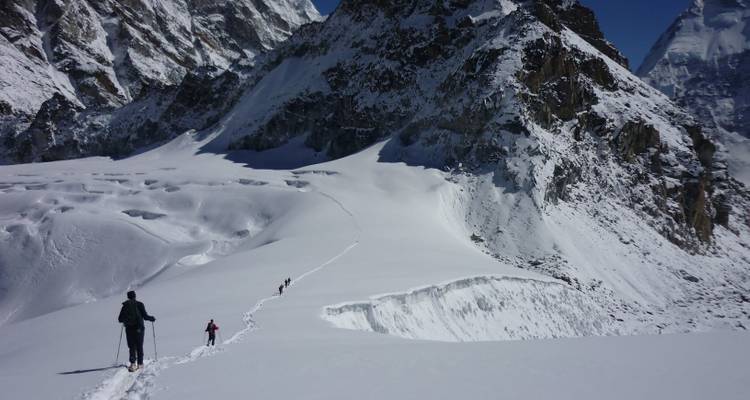 Trekking in snowy mountains with majestic views.