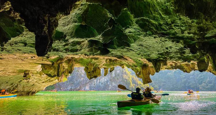Kayaking in a cave with stunning rock formations.
