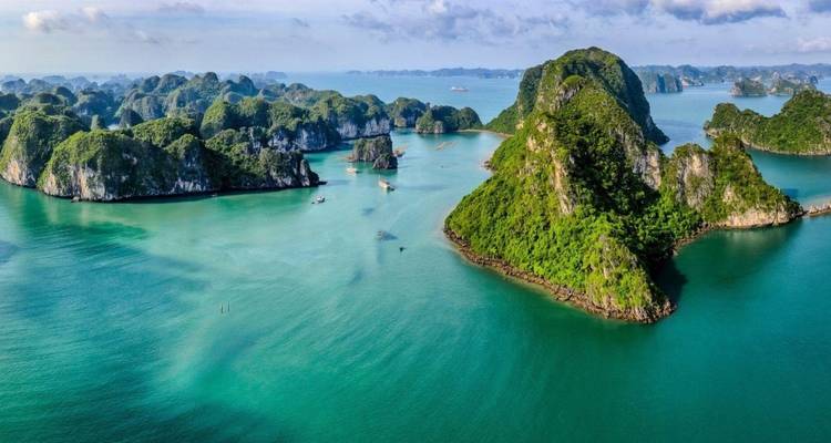 Aerial view of Halong Bay with islands and turquoise waters.