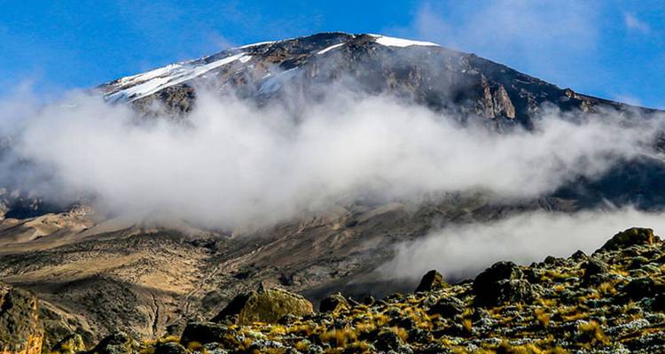 Mountain landscape with clouds partially covering the peak.
