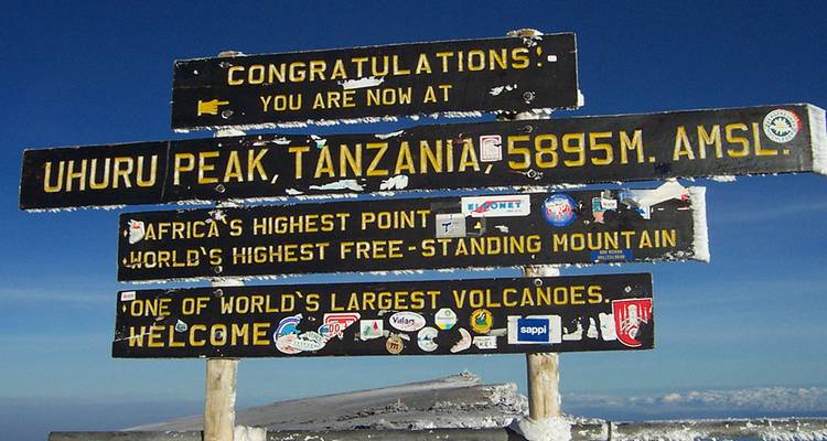 Sign at Uhuru Peak, Tanzania, highlighting its altitude.