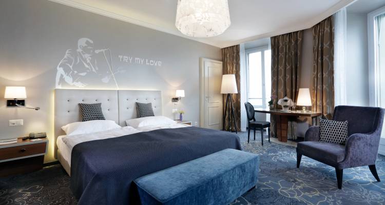 Modern hotel room with stylish decor and large windows