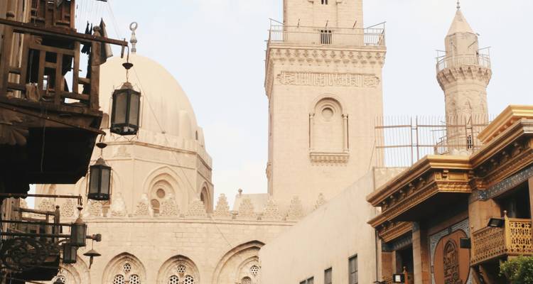 Historic Islamic architecture with minarets and intricate wooden balconies in Cairo’s old quarter.