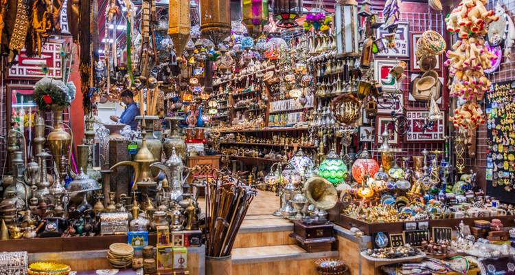 A labyrinth of colourful lamps, brassware and trinkets fills a lively alley of Muscat’s Muttrah Souk.