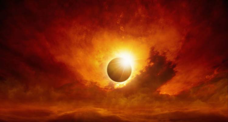 Dramatic artistic image of a solar eclipse with fiery orange clouds—not a travel scene.