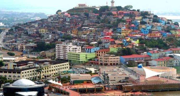 Panoramic view of colorful hillside neighborhood Las Peñas overlooking Guayaquil waterfront.