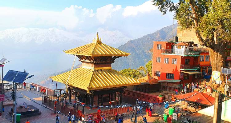 Golden-roofed Manakamana Temple complex perched on ridge bustling with pilgrims.