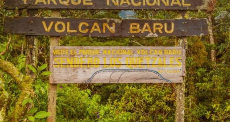 Weathered wooden signs mark the entrance to Parque Nacional Volcán Barú and the Quetzales trail.
