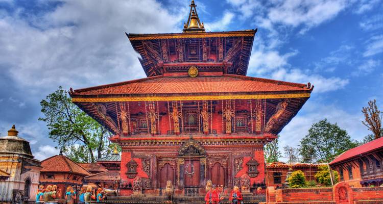 Vibrant HDR image of Changu Narayan temple with tourists admiring its ornate tiered roof and carvings