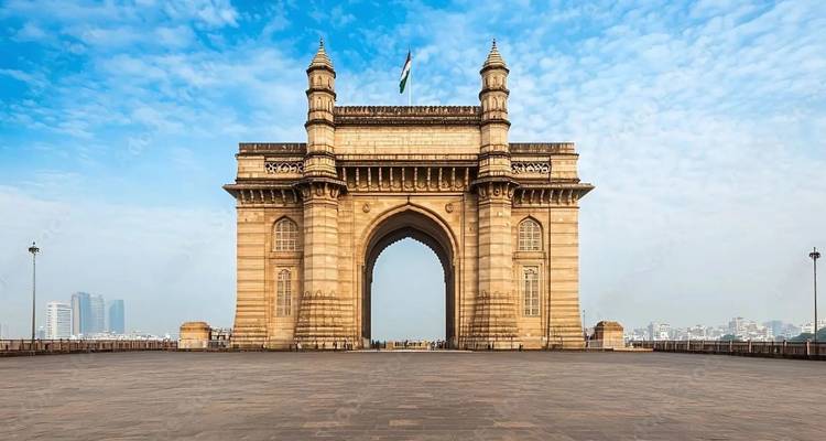 The Gateway of India monument standing majestically against a clear blue sky