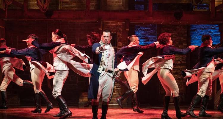 Energetic cast performs a dramatic dance number in the Broadway musical Hamilton.