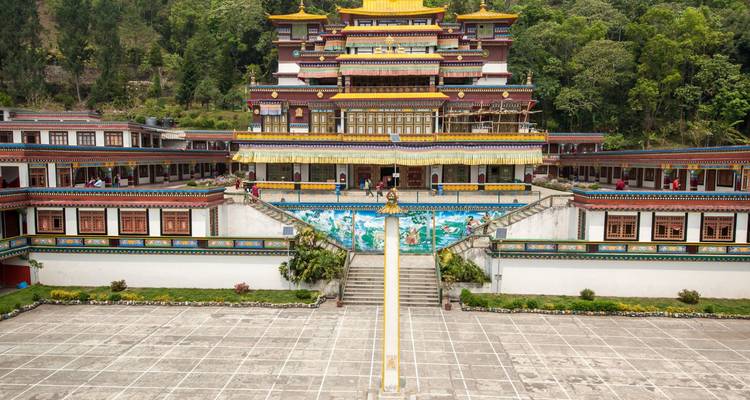 Symmetrical view of a brightly painted Tibetan Buddhist monastery and courtyard.