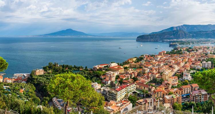 Panoramic view over Sorrento town and Bay of Naples with Mount Vesuvius in distance