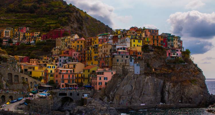 Vibrant cliff-side village of Manarola in Cinque Terre perched above the Ligurian Sea.