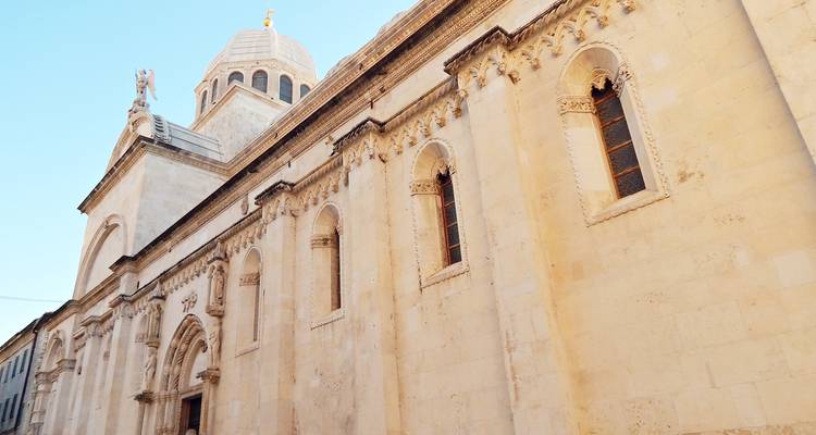 Detailed facade of Sibenik Cathedral of St. James glowing in warm afternoon light