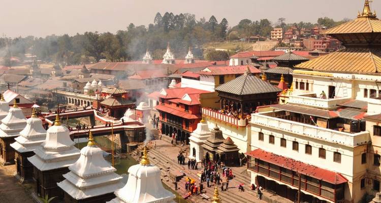 Smoke rising over the sprawling Pashupatinath Temple complex and Bagmati River cremation ghats.