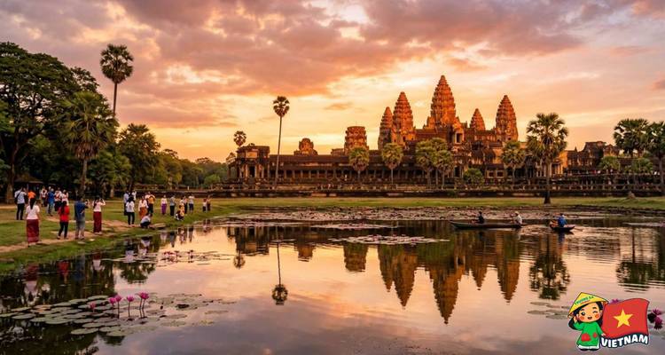 Golden evening light illuminates the iconic Angkor Wat temple complex reflected in a lotus pond.
