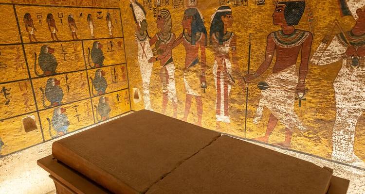 Colourful wall paintings and a stone sarcophagus inside King Tutankhamun’s tomb replica.