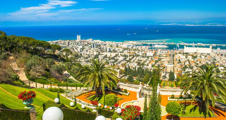Panoramic view over Haifa and its lush gardens toward the shimmering Mediterranean Sea.