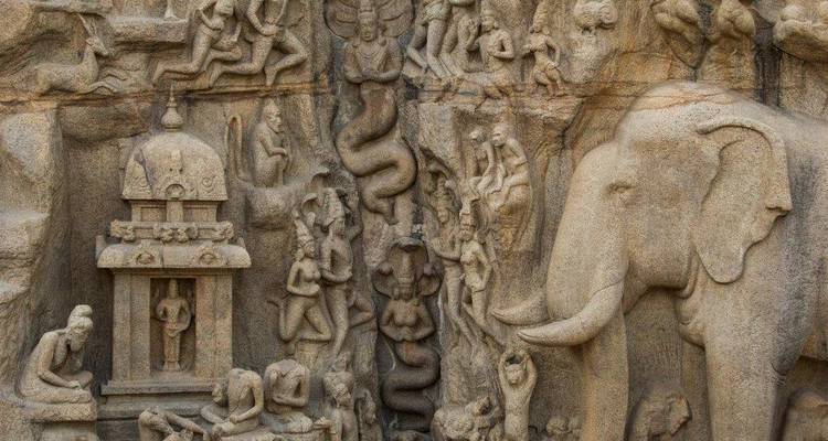 Detailed stone bas-relief of Arjuna’s Penance depicts mythological figures and an elephant.