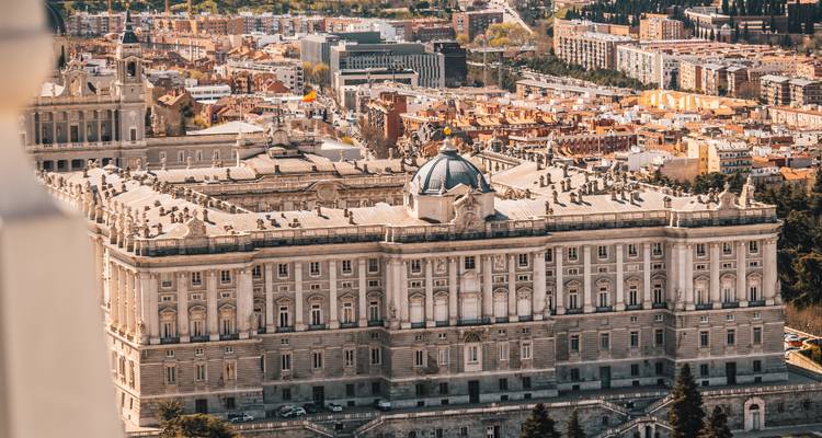 Aerial close-up of Madrid’s grand Royal Palace with surrounding cityscape