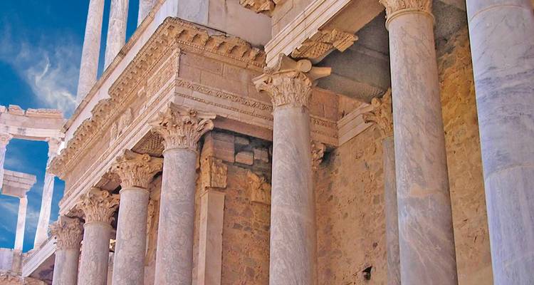 Close-up of ornate marble columns in an ancient Roman theatre