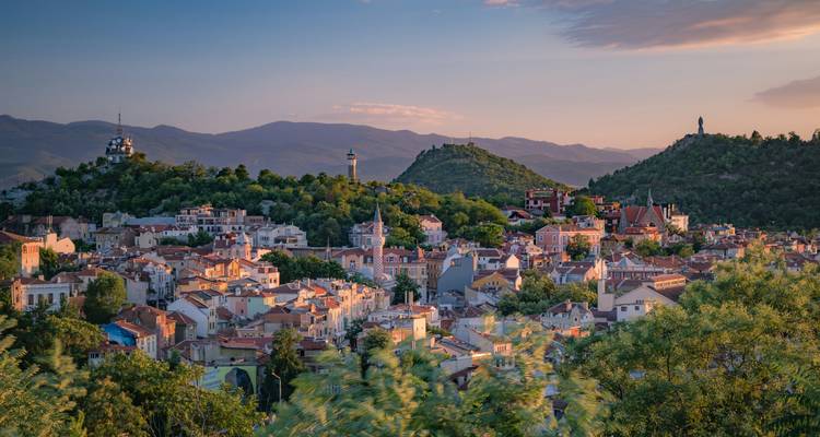 Panoramic sunset view over Plovdiv’s old town with hills and pastel houses in Bulgaria