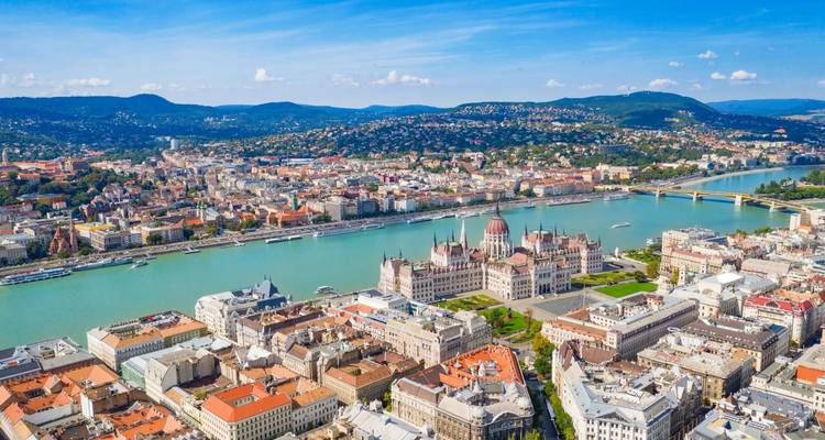 Stunning aerial view of Budapest with the Hungarian Parliament Building on the Danube River under clear skies