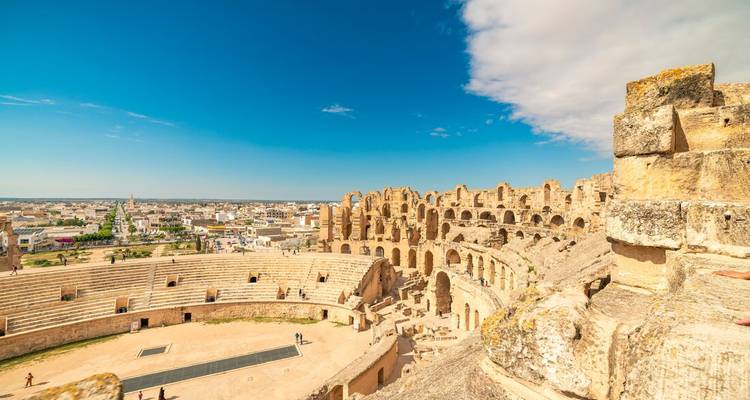 Interior panoramic view of El Jem amphitheatre overlooking the arena and town beyond