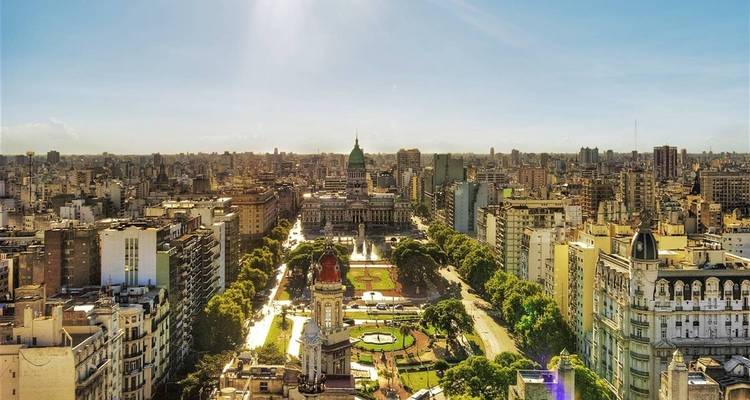 Aerial panorama of Buenos Aires city skyline and Congressional Plaza under bright sun.