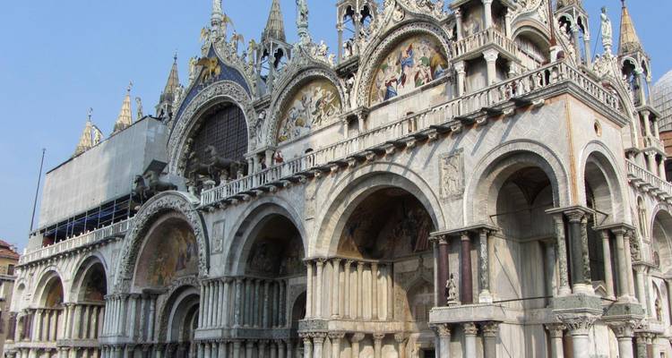 Close-up of St Mark’s Basilica with its ornate arches, mosaics and sculptures in Venice.