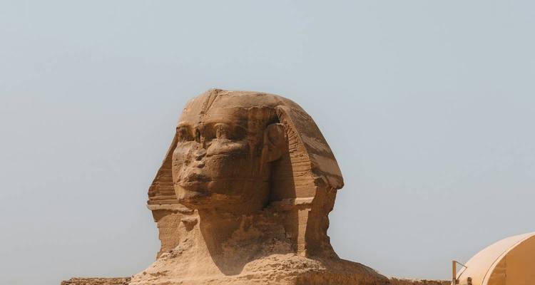 Side profile of the Sphinx against a pale blue sky