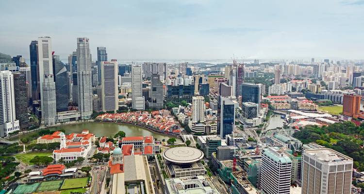 High-angle cityscape of Singapore’s downtown skyline with modern skyscrapers and the historic riverside district