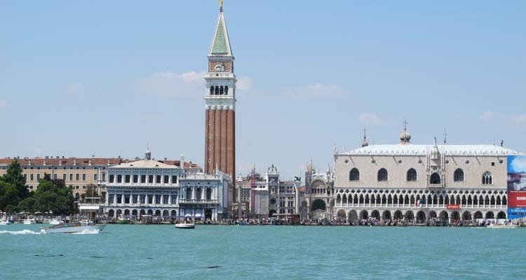 View across the lagoon to St Mark's Campanile and Doge's Palace rising above Venice.