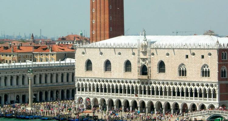 Crowds gather outside the Doge's Palace and St Mark's Square seen from above.